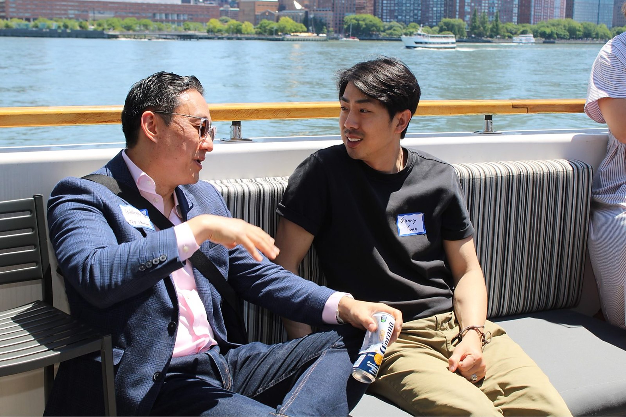 An investor and a founder talking on a bench aboard the Hornblower Lexington at the Heartland Venture Summit